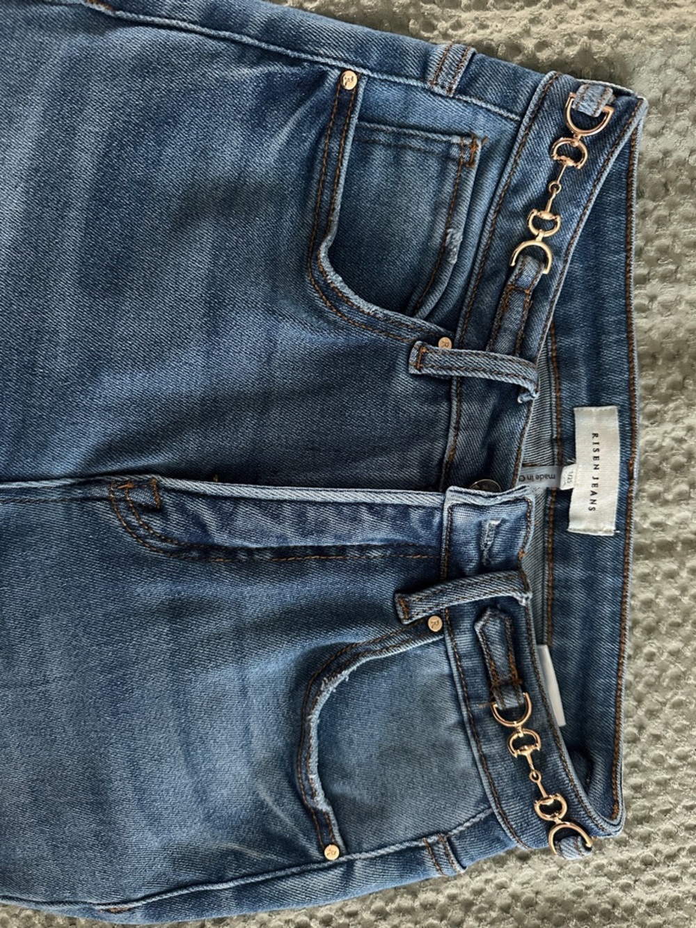 High-Rise Blue Denim Jeans with Gold Chain Waist Detail